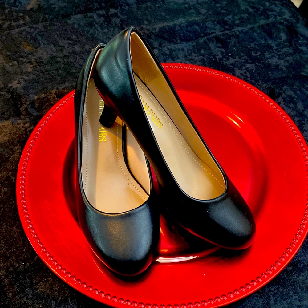 Black pumps. Round toe, small 2” petite heel. Brand new, never worn.